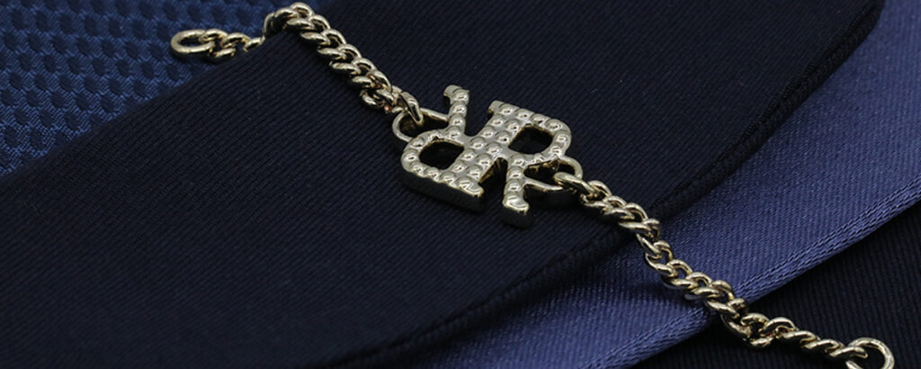 Metal logo badge trim for garment production and branding
