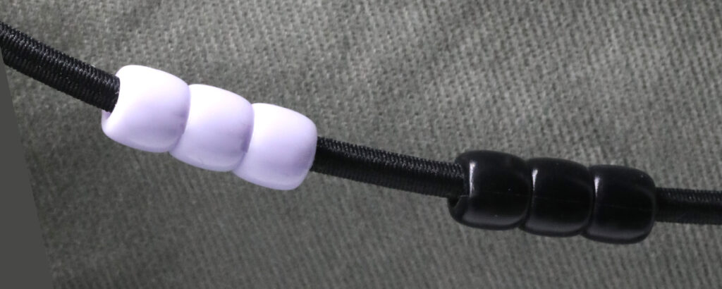 Custom cord bead trim for garment production