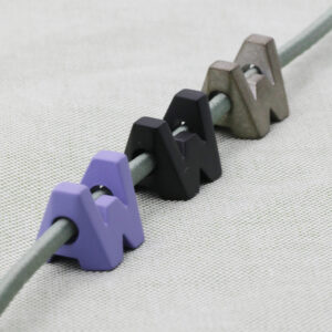 Coloured custom beads for apparel drawcord manufacturing