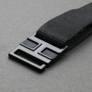 Black webbing buckle for functional trim and fastening systems