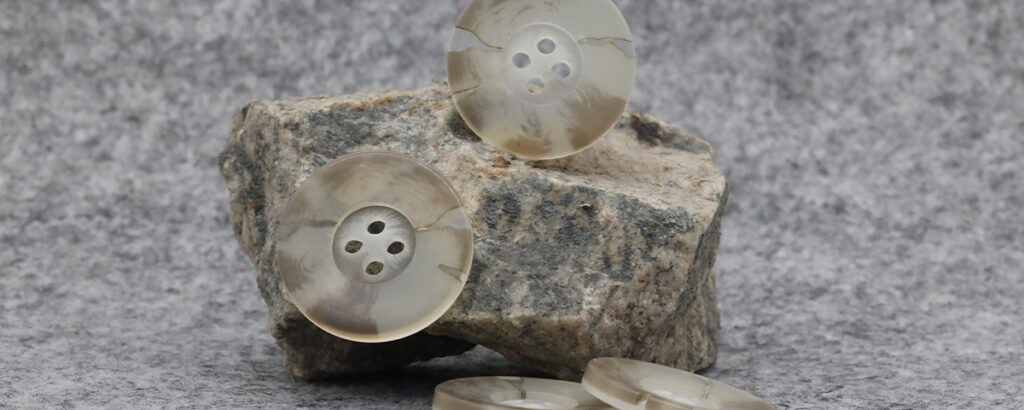 Button trims for apparel manufacturers and garment collections