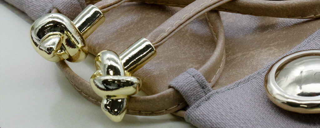 Cord end trims for apparel manufacturers and accessory collections