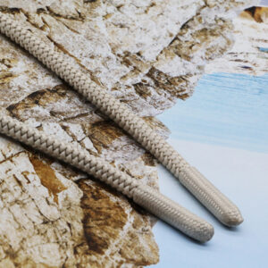 Flat braided drawcord detail for adjustable garment applications