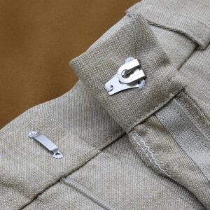 Hook and eye closure detail applied to garment fabric