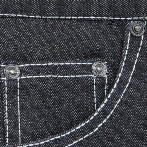 Metal rivets applied to denim pocket construction