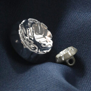 Detailed shank button design for branded garment applications