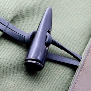 Toggle closure detail used with drawcords on garment fabric